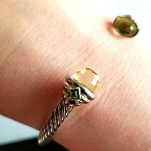 Cuff bracelet with yellow end gems and green square gems twist cable style